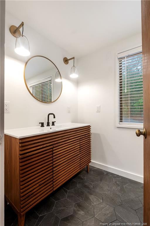 916 Rays Bridge Rd, Whispering Pines, NC 28327 - bathroom featuring vanity and baseboards