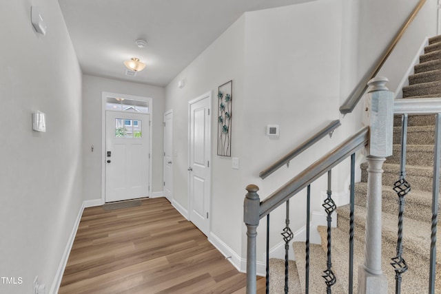 1126 Apogee Dr, Durham, NC 27713 - entryway with wood finished floors and stairway