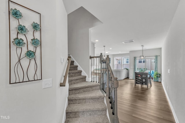 1126 Apogee Dr, Durham, NC 27713 - staircase featuring wood finished floors and recessed lighting