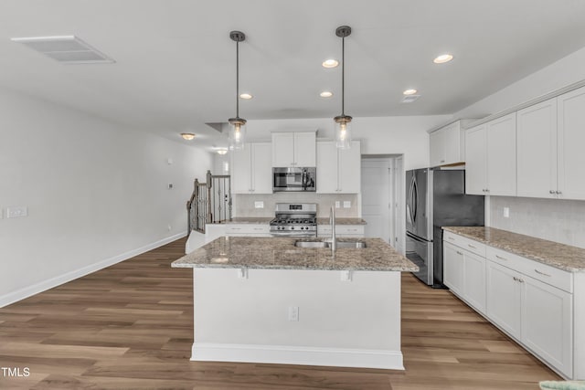 1126 Apogee Dr, Durham, NC 27713 - kitchen with appliances with stainless steel finishes, light wood-style flooring, recessed lighting, and white cabinets