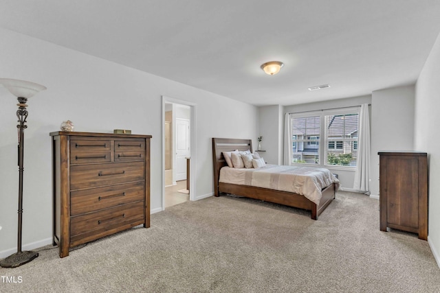1126 Apogee Dr, Durham, NC 27713 - carpeted bedroom with baseboards and connected bathroom