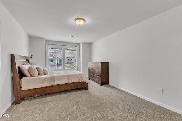 1126 Apogee Dr, Durham, NC 27713 - bedroom with light colored carpet and baseboards