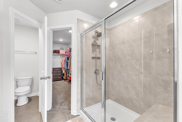 1126 Apogee Dr, Durham, NC 27713 - bathroom with a shower stall, a walk in closet, and tile patterned flooring