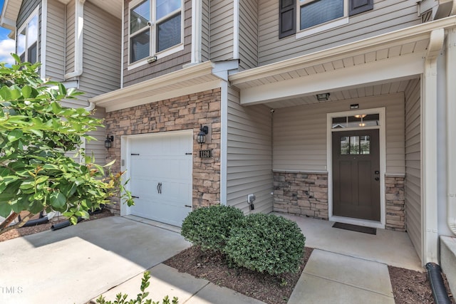 1126 Apogee Dr, Durham, NC 27713 - entrance to property with stone siding and an attached garage