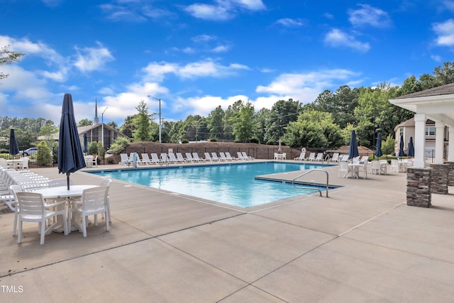1126 Apogee Dr, Durham, NC 27713 - community pool featuring a patio and view of scattered trees