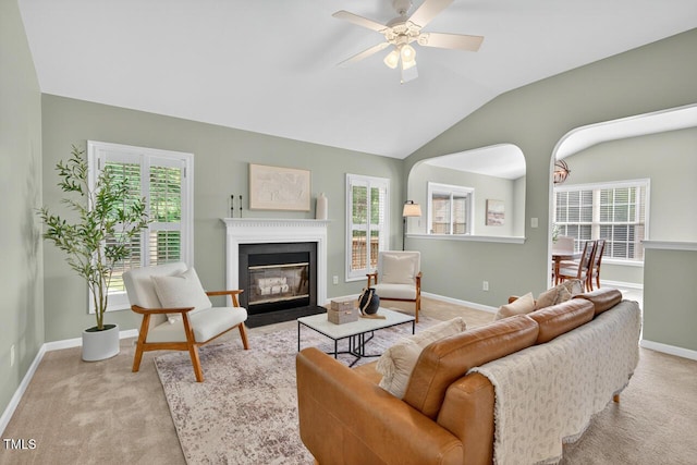 1004 Scotsburg Trl, Hillsborough, NC 27278 - living room featuring a fireplace with flush hearth, ceiling fan, carpet floors, and lofted ceiling