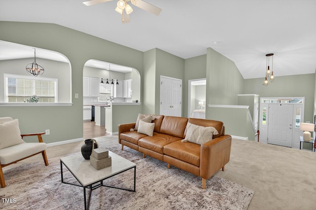 1004 Scotsburg Trl, Hillsborough, NC 27278 - living room featuring vaulted ceiling, light colored carpet, a ceiling fan, and a chandelier
