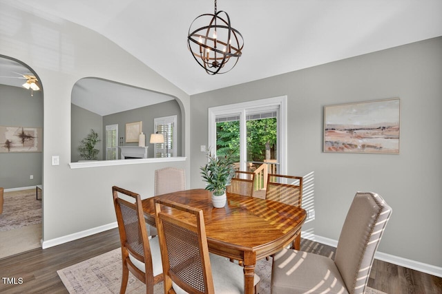 1004 Scotsburg Trl, Hillsborough, NC 27278 - dining space featuring lofted ceiling, a chandelier, dark wood-style floors, and a ceiling fan