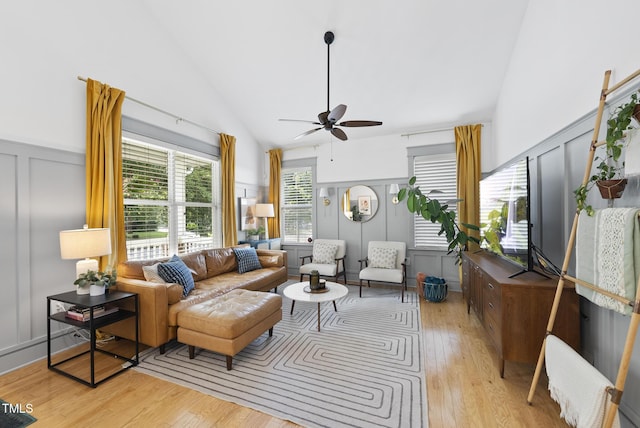 1010 S Person St, Raleigh, NC 27601 - living area with a decorative wall, light wood-style flooring, ceiling fan, and high vaulted ceiling