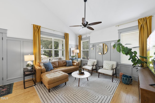 1010 S Person St, Raleigh, NC 27601 - living area featuring a decorative wall, light wood-style flooring, ceiling fan, high vaulted ceiling, and a wainscoted wall