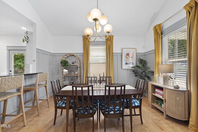 1010 S Person St, Raleigh, NC 27601 - dining space with a decorative wall, light wood-style floors, healthy amount of natural light, a wainscoted wall, and a chandelier