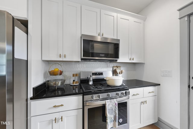 1010 S Person St, Raleigh, NC 27601 - kitchen with stainless steel appliances, backsplash, and white cabinetry