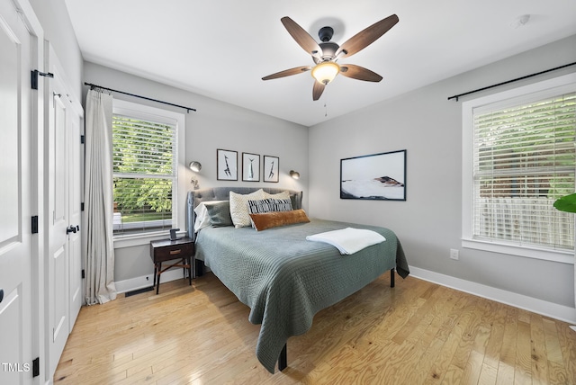1010 S Person St, Raleigh, NC 27601 - bedroom with light wood finished floors and ceiling fan