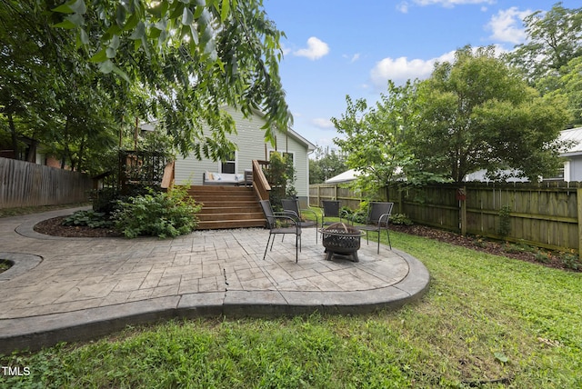 1010 S Person St, Raleigh, NC 27601 - fenced backyard with an outdoor fire pit, a wooden deck, a patio, and stairway