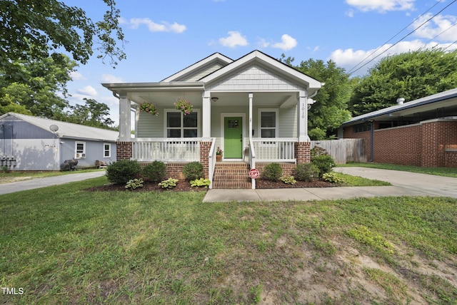 1010 S Person St, Raleigh, NC 27601 - view of front of house featuring covered porch and brick siding