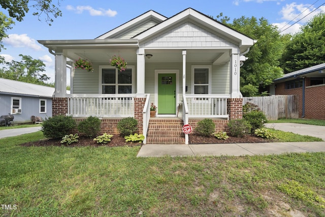 1010 S Person St, Raleigh, NC 27601 - view of front facade featuring a porch and brick siding