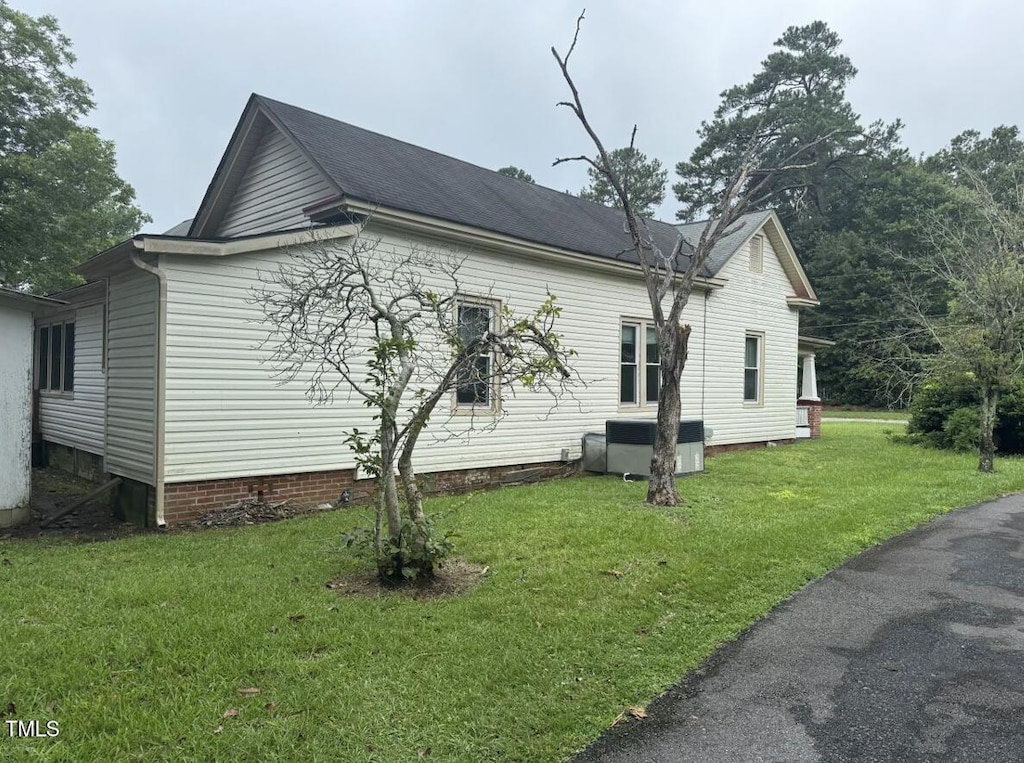 220 E Branch St, Spring Hope, NC 27882 - view of side of property with crawl space and a yard