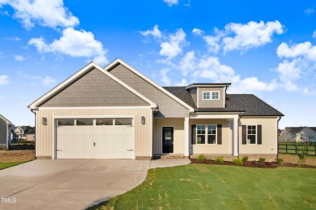134 Cherrybirch Ln, Zebulon, NC 27597 - craftsman-style home featuring driveway, an attached garage, and a shingled roof