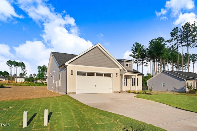 134 Cherrybirch Ln, Zebulon, NC 27597 - craftsman house with an attached garage, driveway, a front lawn, and board and batten siding