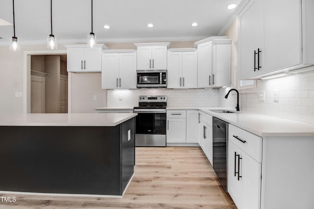134 Cherrybirch Ln, Zebulon, NC 27597 - kitchen featuring appliances with stainless steel finishes, crown molding, tasteful backsplash, white cabinets, and light wood-style flooring