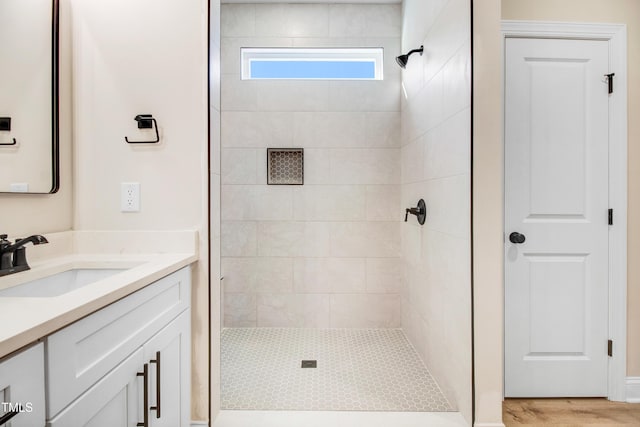 134 Cherrybirch Ln, Zebulon, NC 27597 - bathroom with a tile shower, vanity, and wood finished floors