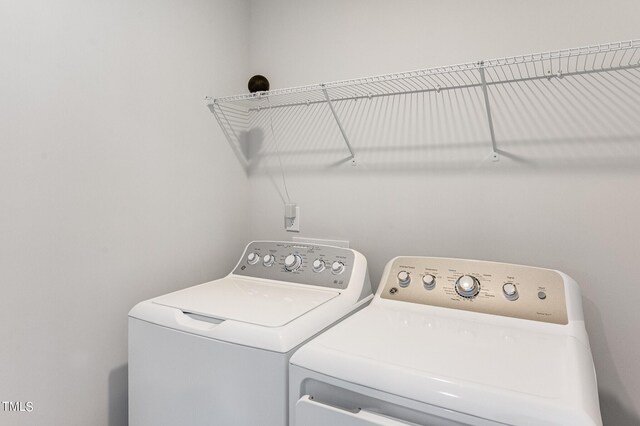 1151 Weavers Trace Dr, Zebulon, NC 27597 - laundry room with washing machine and clothes dryer