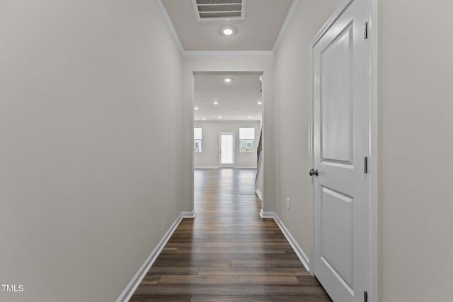 5721 Woodlawn Dr, Durham, NC 27703 - hallway with dark wood-style floors, crown molding, and recessed lighting