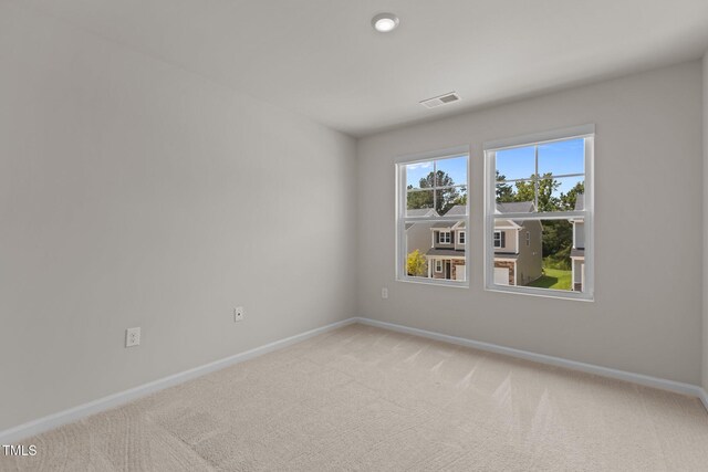 5721 Woodlawn Dr, Durham, NC 27703 - unfurnished room with baseboards and carpet