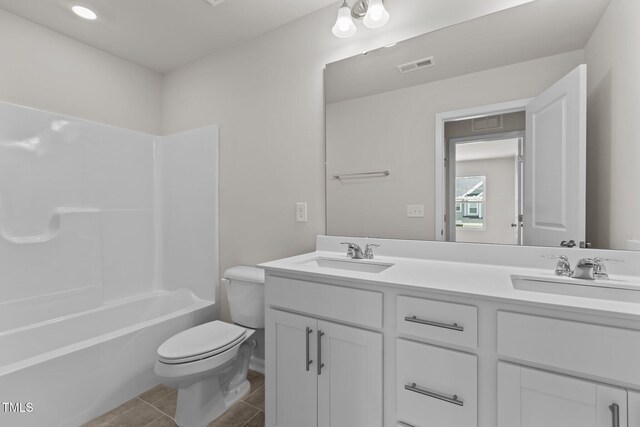 5721 Woodlawn Dr, Durham, NC 27703 - bathroom featuring double vanity, tile patterned flooring, and shower / bath combination