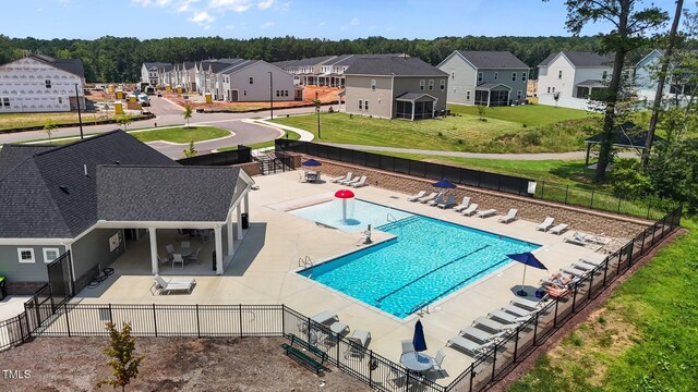5721 Woodlawn Dr, Durham, NC 27703 - community pool featuring a patio area and a residential view