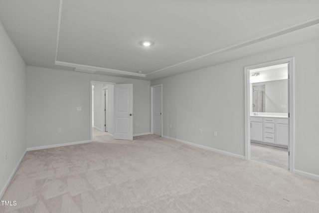 223 Aster Bloom Ln, Raleigh, NC 27610 - unfurnished bedroom featuring light carpet and connected bathroom