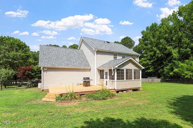 20 Allyson Ct, Youngsville, NC 27596 - rear view of property featuring a sunroom, a fenced backyard, a wooden deck, and roof with shingles
