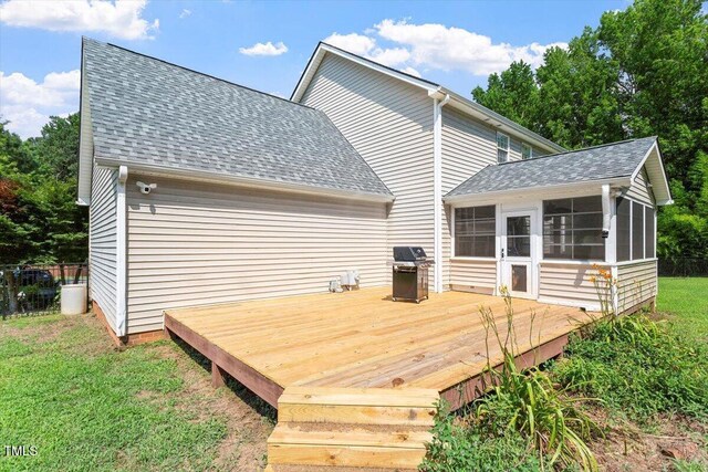 20 Allyson Ct, Youngsville, NC 27596 - wooden deck featuring a sunroom, a lawn, and a grill