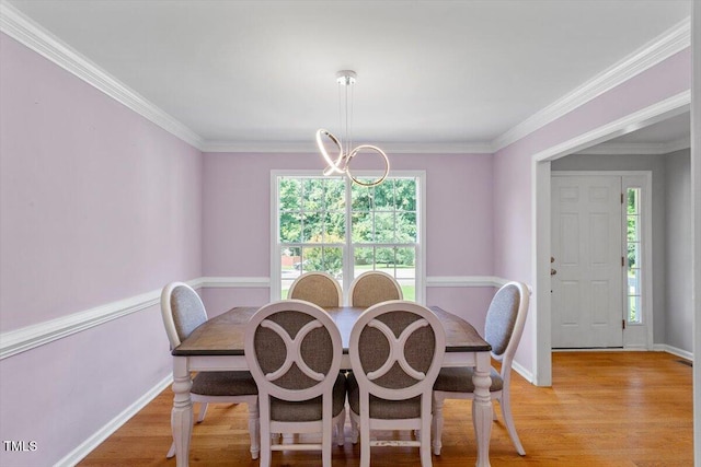 20 Allyson Ct, Youngsville, NC 27596 - dining area featuring light wood-style floors, a chandelier, and ornamental molding