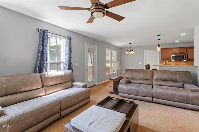 20 Allyson Ct, Youngsville, NC 27596 - living area featuring plenty of natural light, a ceiling fan, a chandelier, light colored carpet, and recessed lighting