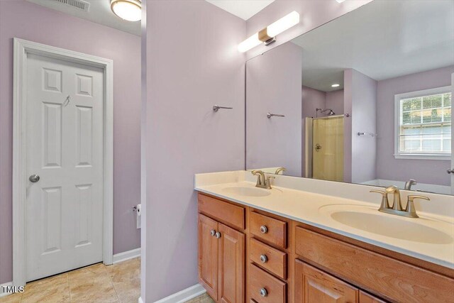 20 Allyson Ct, Youngsville, NC 27596 - full bathroom featuring double vanity, a shower, and tile patterned floors