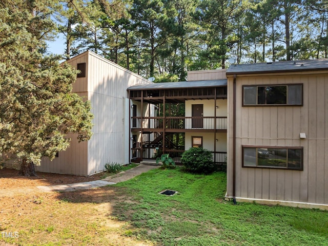 667 Pine Ridge Pl, Raleigh, NC 27609 - back of house with a lawn