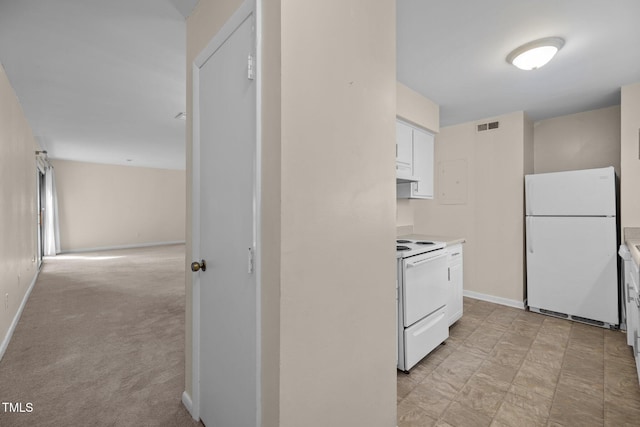 667 Pine Ridge Pl, Raleigh, NC 27609 - kitchen featuring white appliances, white cabinets, light countertops, and under cabinet range hood