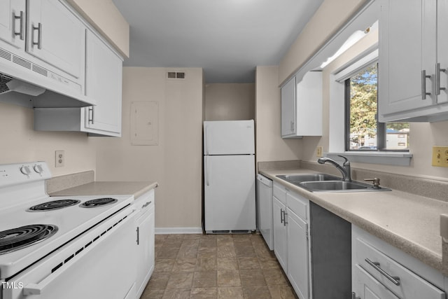 667 Pine Ridge Pl, Raleigh, NC 27609 - kitchen featuring white appliances, under cabinet range hood, electric panel, light countertops, and stone finish flooring
