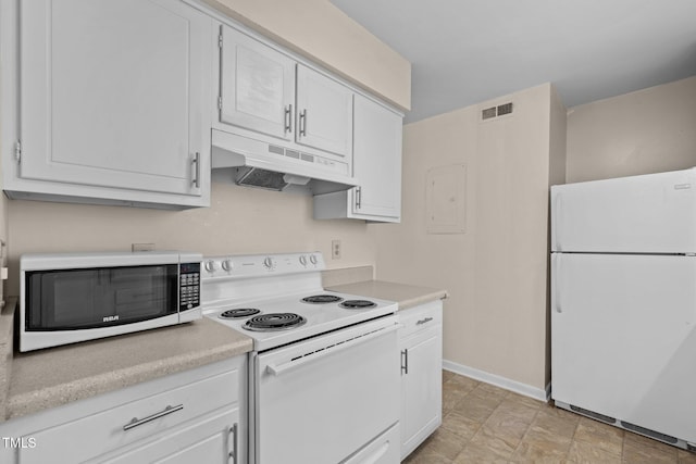 667 Pine Ridge Pl, Raleigh, NC 27609 - kitchen with white appliances, under cabinet range hood, light countertops, and white cabinetry