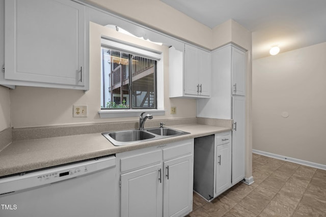 667 Pine Ridge Pl, Raleigh, NC 27609 - kitchen featuring white dishwasher, white cabinetry, and light countertops