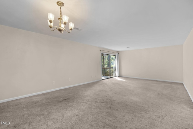 667 Pine Ridge Pl, Raleigh, NC 27609 - carpeted spare room featuring a chandelier and baseboards