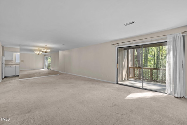 667 Pine Ridge Pl, Raleigh, NC 27609 - unfurnished living room with a chandelier and light carpet