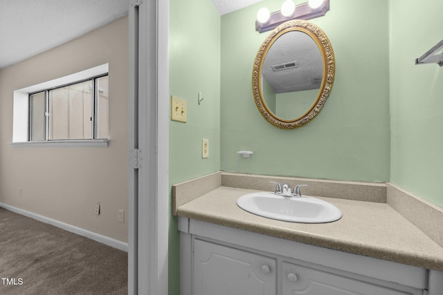 667 Pine Ridge Pl, Raleigh, NC 27609 - bathroom with vanity and a textured ceiling