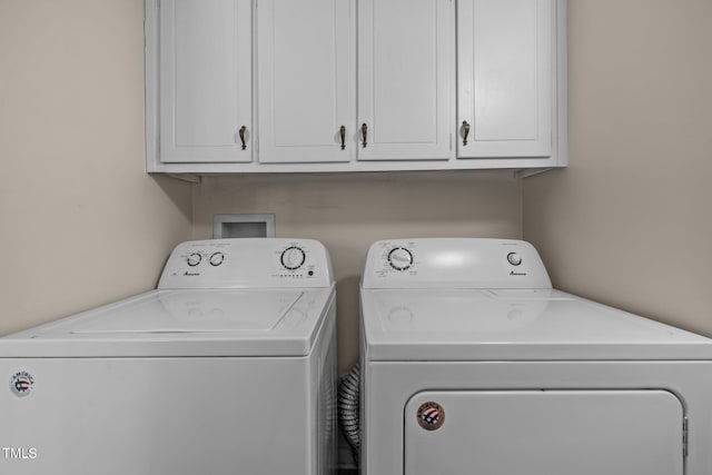 667 Pine Ridge Pl, Raleigh, NC 27609 - laundry area featuring washing machine and dryer and cabinet space