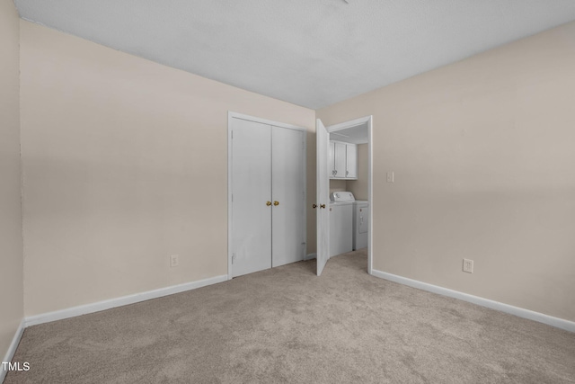 667 Pine Ridge Pl, Raleigh, NC 27609 - unfurnished bedroom with separate washer and dryer, light carpet, and a closet