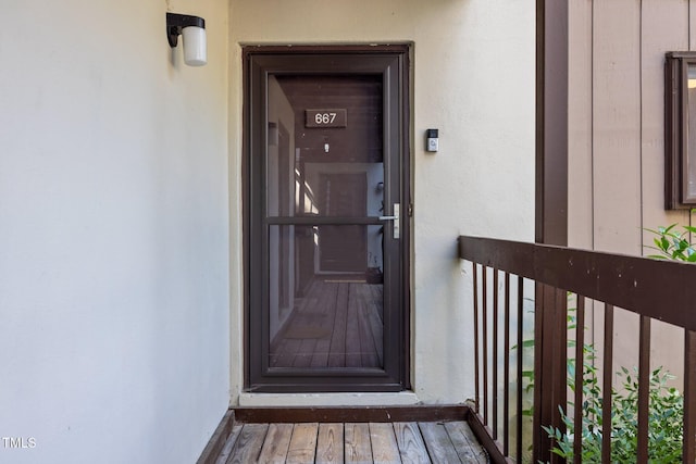 667 Pine Ridge Pl, Raleigh, NC 27609 - doorway to property featuring stucco siding