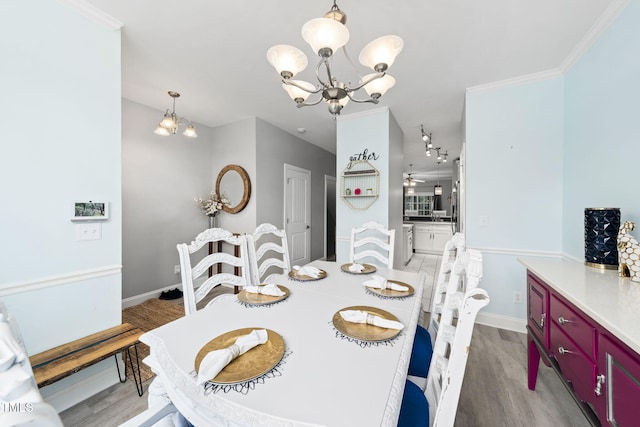 7645 Winners Edge St, Raleigh, NC 27617 - dining room with a chandelier and light wood-style flooring