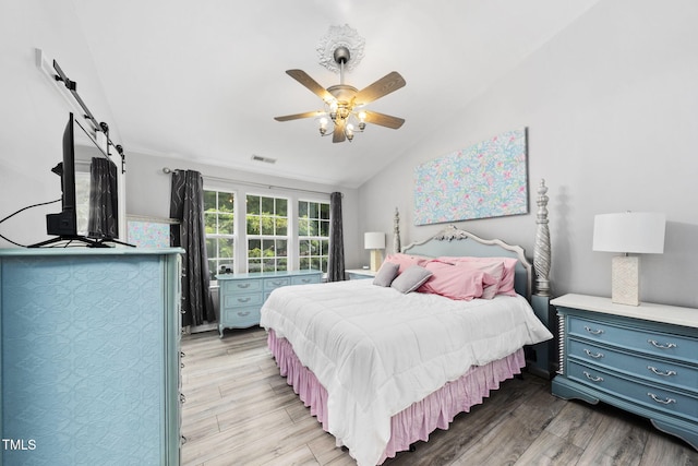 7645 Winners Edge St, Raleigh, NC 27617 - bedroom with lofted ceiling, light wood-style flooring, and ceiling fan