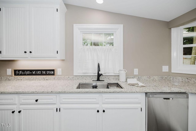 103 N Mckay Ave, Dunn, NC 28334 - kitchen with dishwasher, white cabinets, and light stone counters
